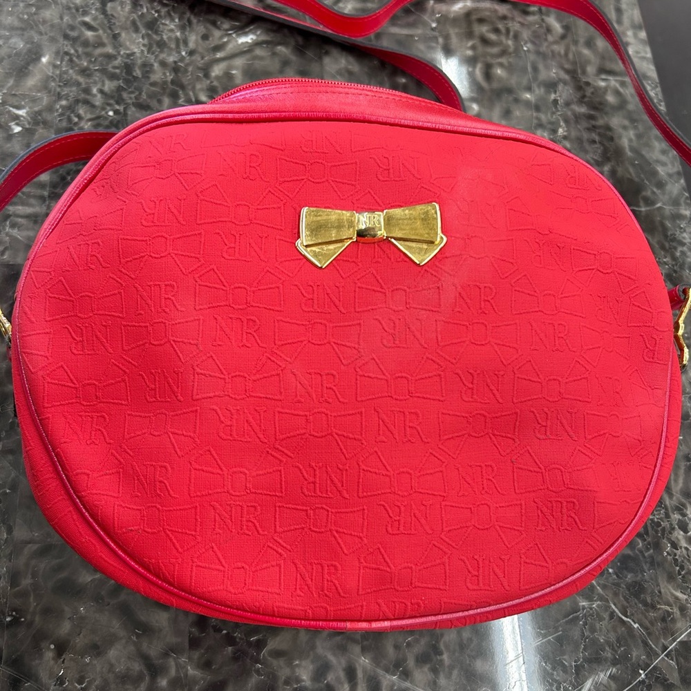 Nina Ricci Vibrant Red Handbag with Gold Accents